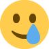 🥲 smiling face with tear display on Twitter